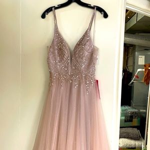 Beautiful rose gold prom dress with delicate beaded details. Soft sparkles